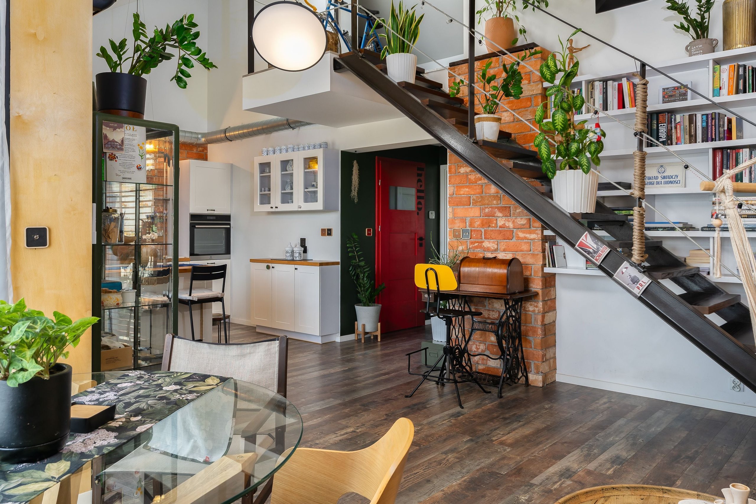 Finished condo interior with an open living area and staircase